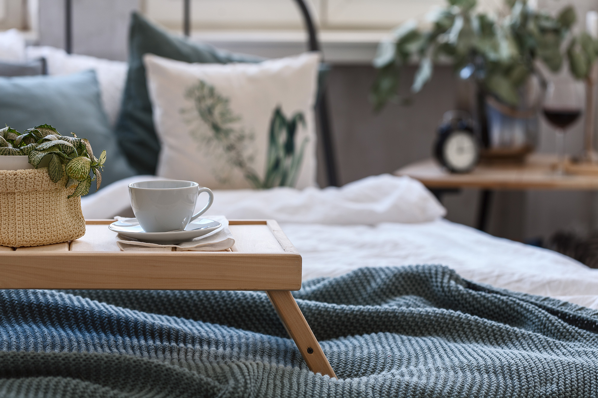 coffee on breakfast tray on bed