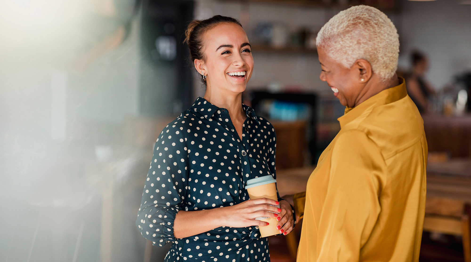 Women smiling with coffee