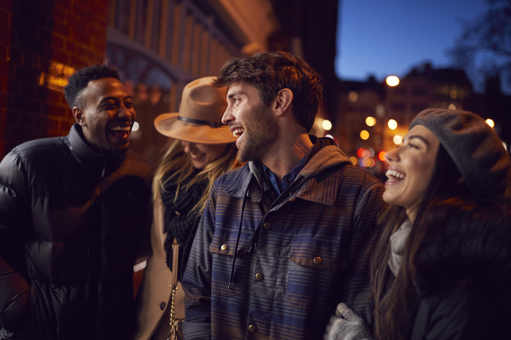 Group in a city outside at nighttime