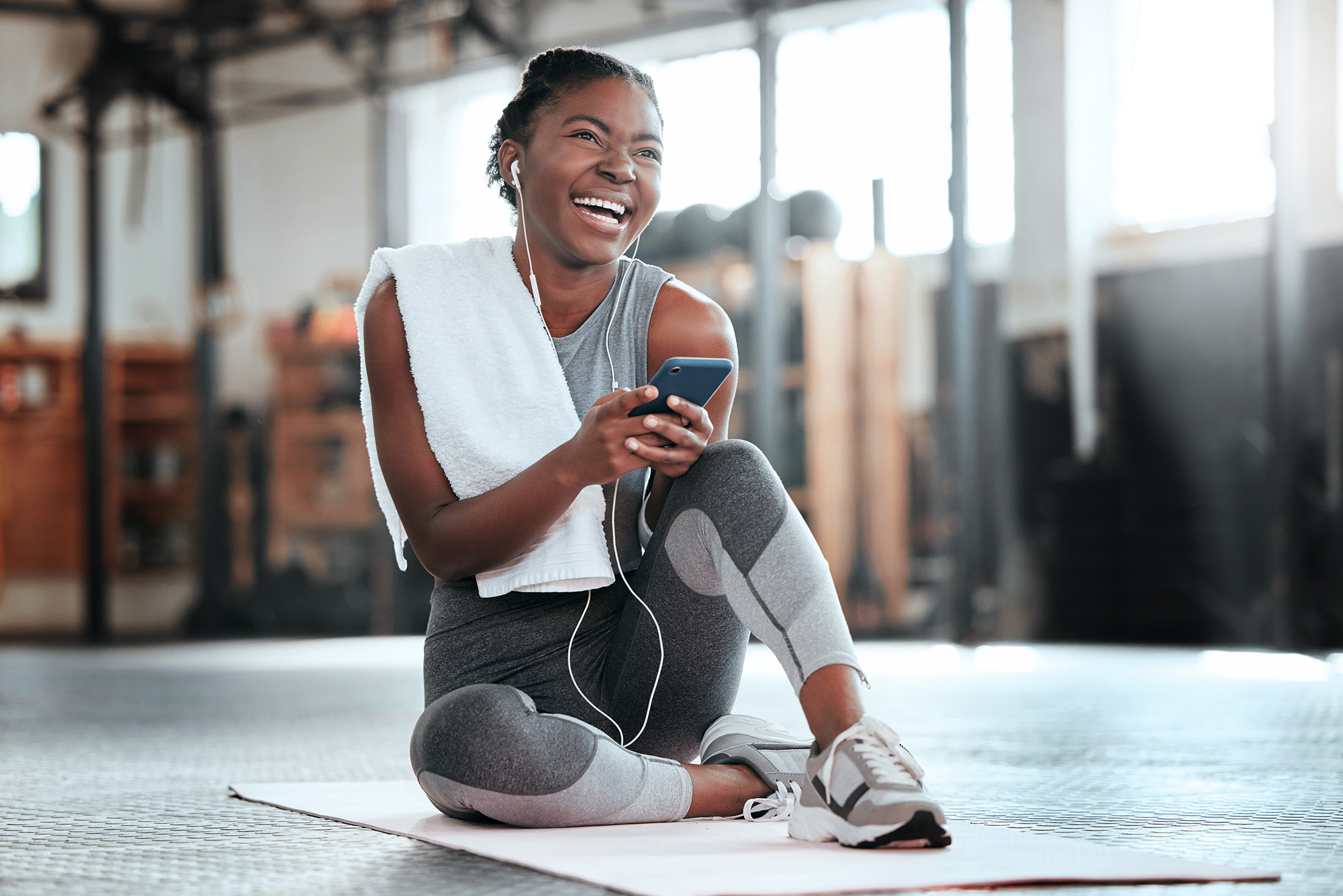 Woman in gym with cell phone