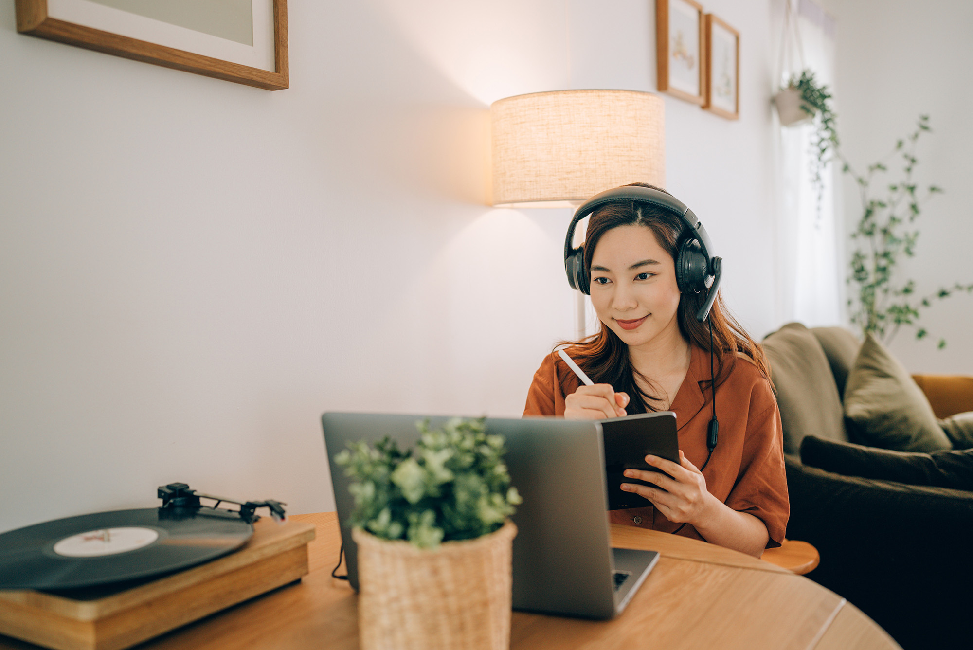 Woman wearing headphones for remote work meeting