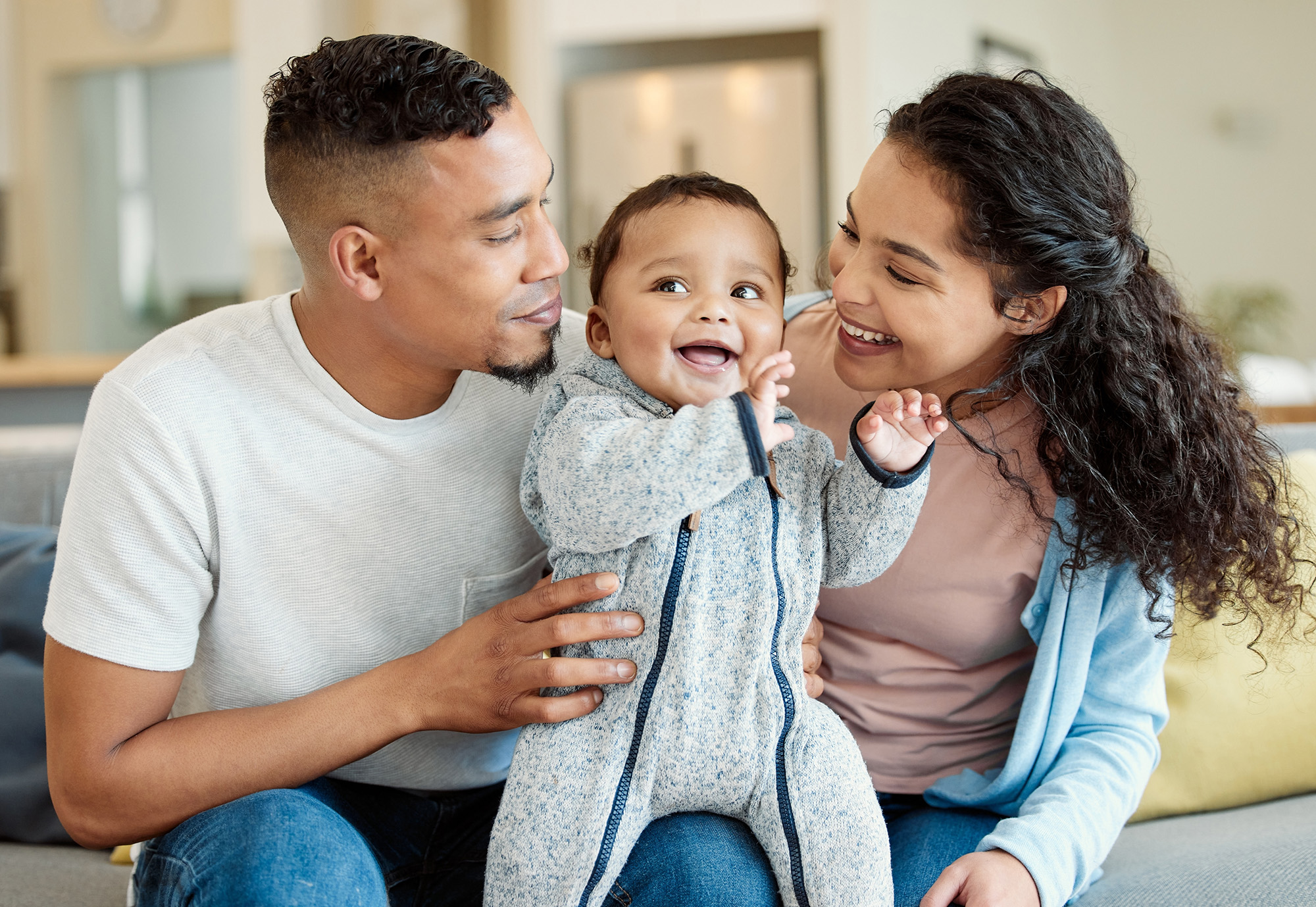 Young couple with smiling baby