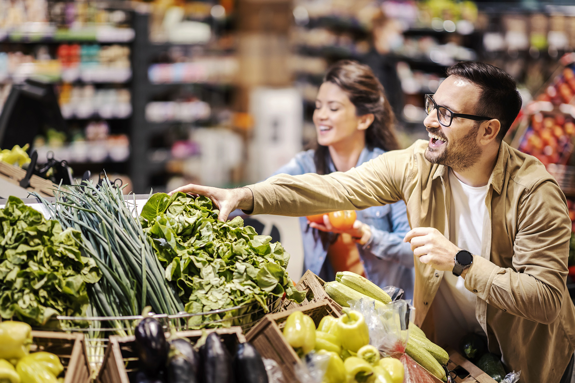 Couple buying produce at market